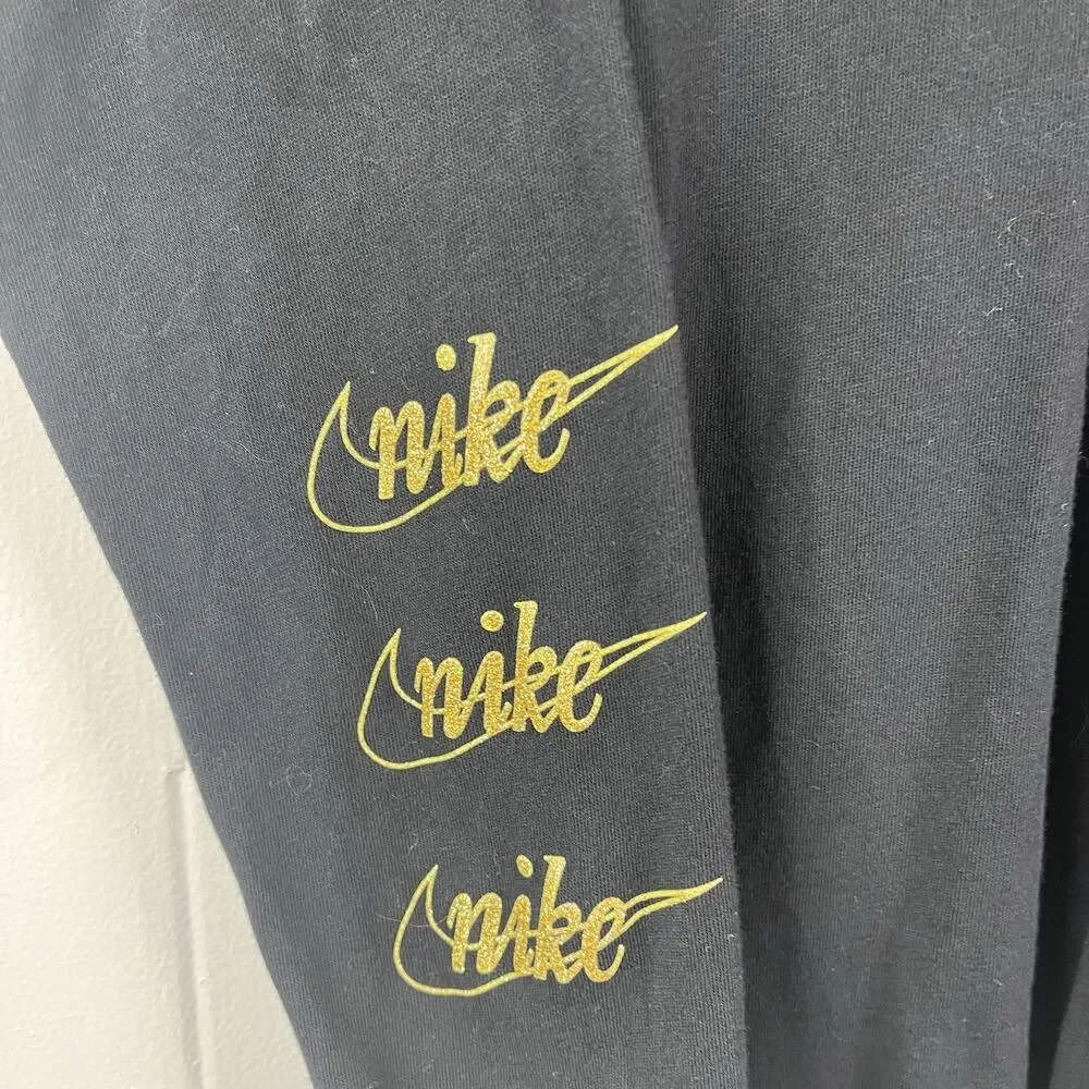 Nike Black long-sleeve t-shirt featuring metallic gold script logos Size Medium